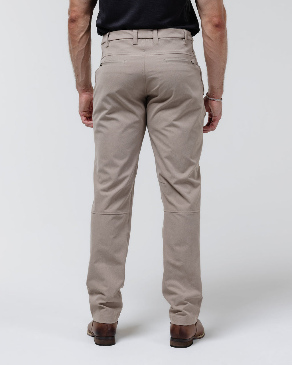 Tan chino pants with pleat seams and tapered straight-leg fit