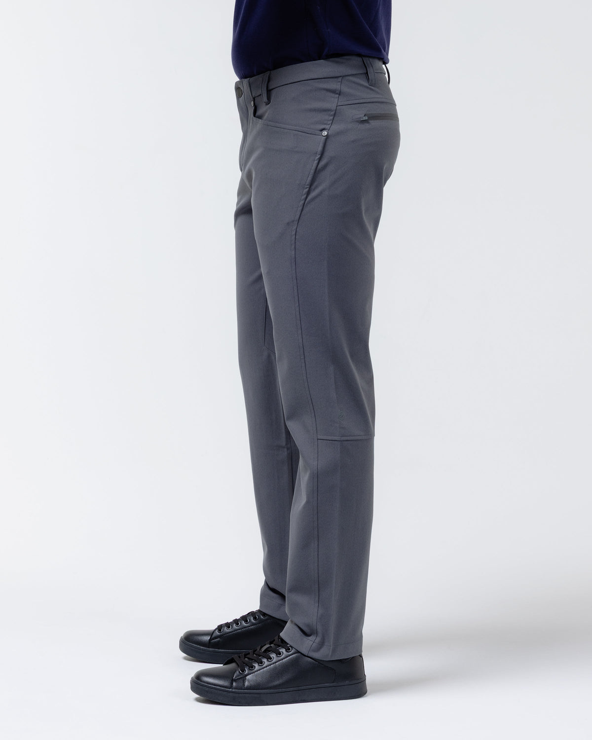 Charcoal chino pants side view with belt loops, stitched seams, and ankle opening