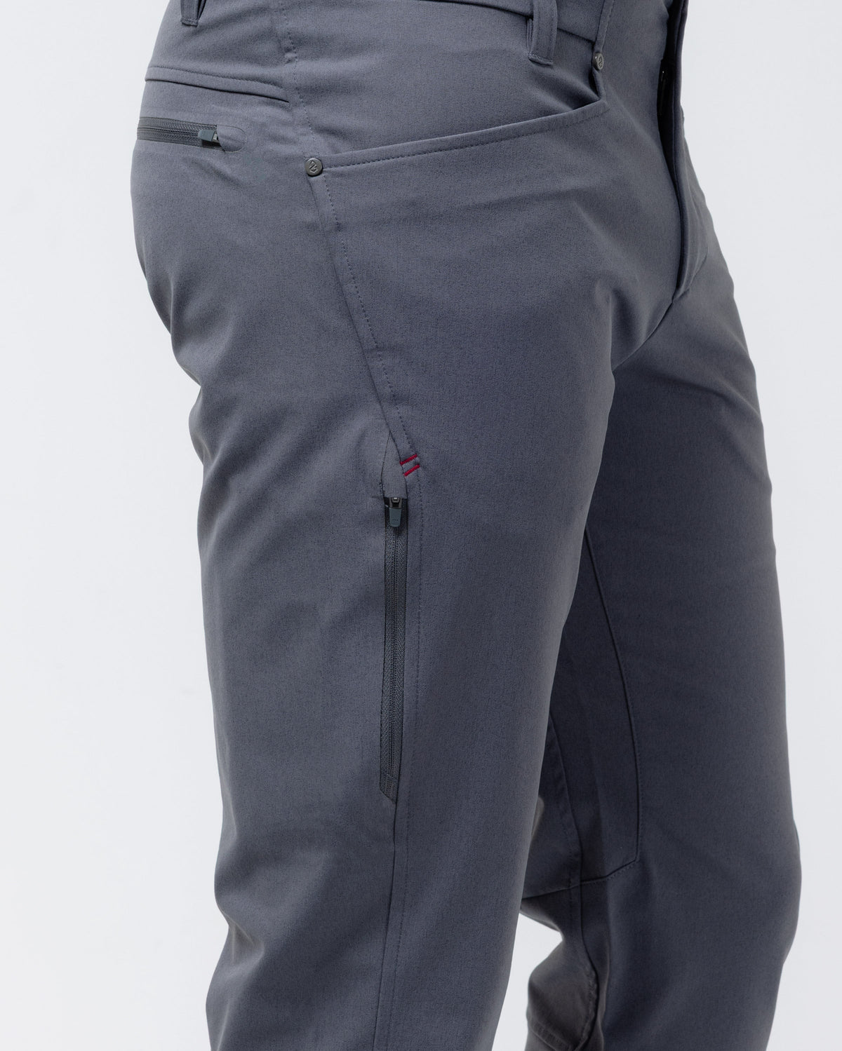 Charcoal chino pants side seam detail with zip pocket and stitched panel lines