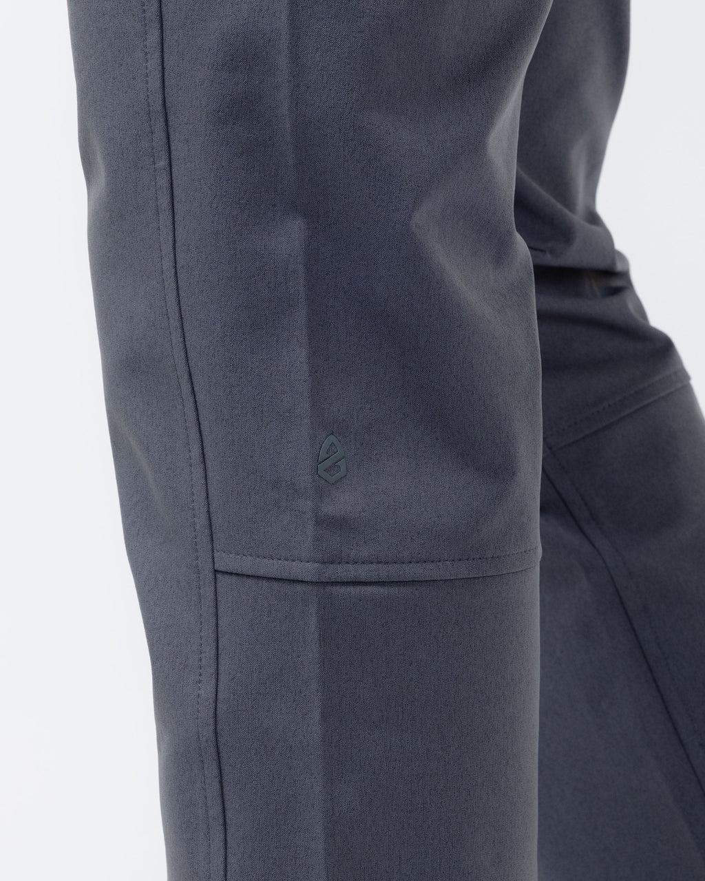 Charcoal chino pants close-up of side zip pocket and fabric panels