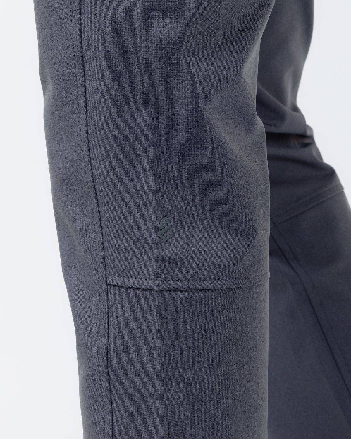 Charcoal chino pants close-up of side zip pocket and fabric panels
