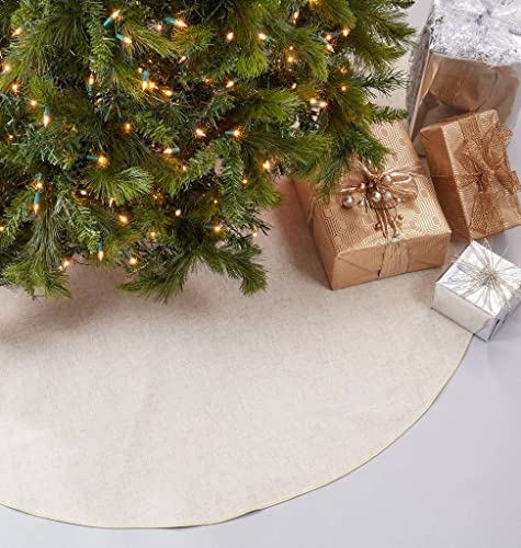 Natural round Christmas tree skirt filling the floor under tree lights and gifts