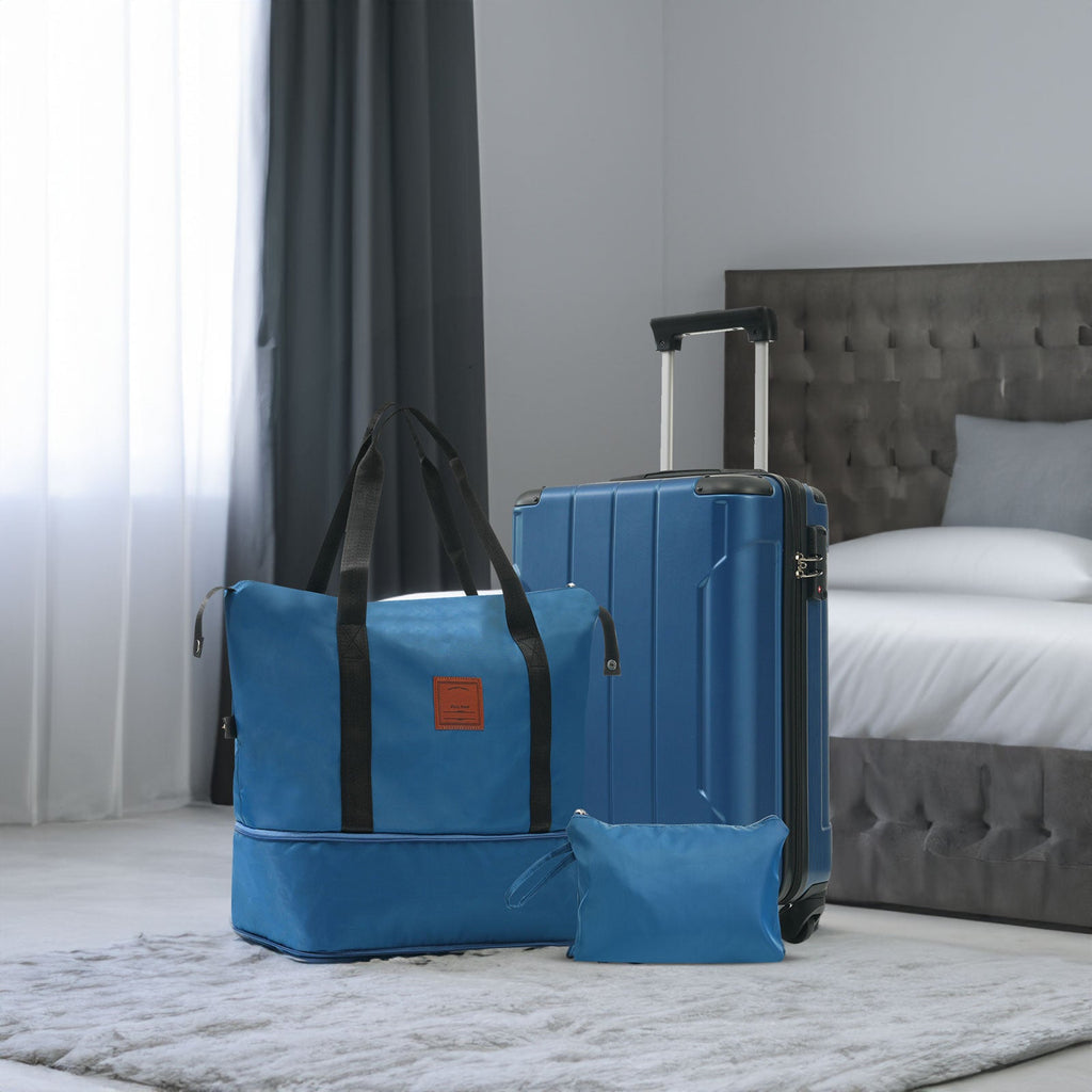 Blue carry-on suitcase with telescoping handle and wheels, with matching blue duffel bag