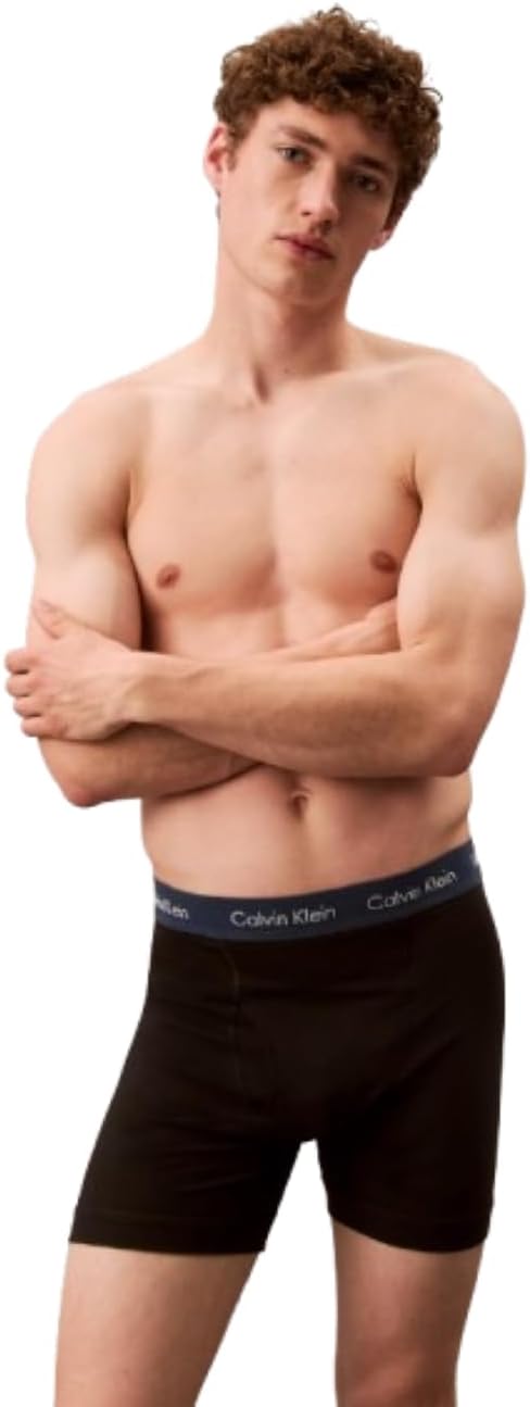Men's Calvin Klein cotton stretch boxer briefs on model, dark (black) boxer silhouette