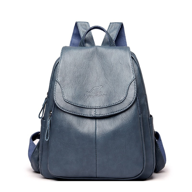 Navy-blue faux-leather backpack with front flap pocket and two side carry straps