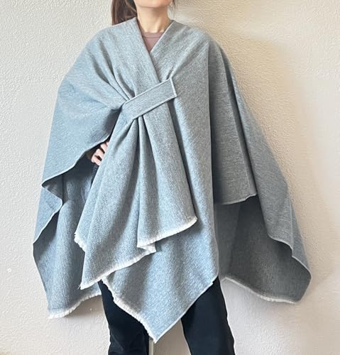 Light blue open-front fringe poncho shawl with front tie and draped cape