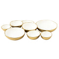 Set of 9 round serving bowls with gold exterior and white enamel centers