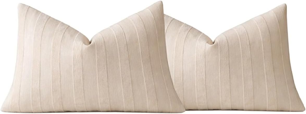 Set of two light beige striped throw pillow covers with textured fabric and knife-edge seams.