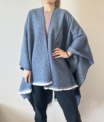 Women’s open-front fringe poncho shawl in blue-grey, draped cape with short sleeve-like shape.