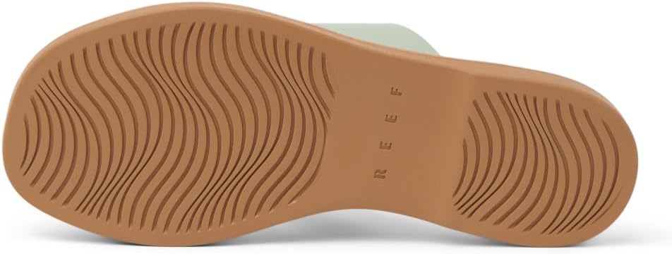 Women's slide sandal outsole with wavy tan traction tread
