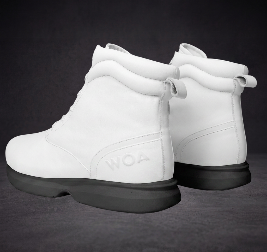 White WOA boot heel-to-toe pair view with lace-up detail and black outsole