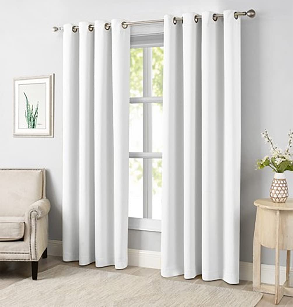 White blackout curtain panels with metal grommets and rod header