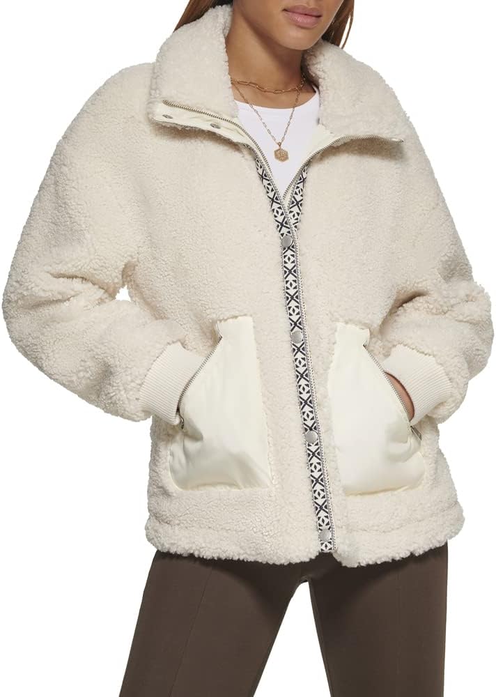 Cream sherpa teddy jacket with full-zip front, sherpa collar, and two patch pockets