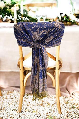 Navy paisley pashmina shawl wrap with gold fringe, tied in a chair display.