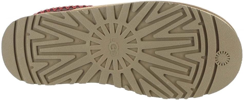 Outsole of Kids' Tazz slipper with textured traction tread in light tan