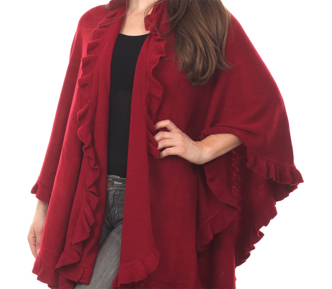 Red knit open-front poncho cape with ruffle trim, draped sleeves and layered hem