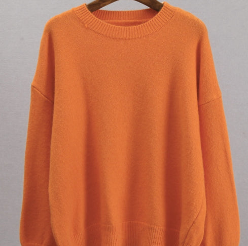 Orange knitted crew-neck sweater with ribbed collar, relaxed loose fit, long sleeves