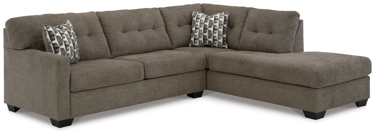 Dark gray sectional sofa with corner chaise and tufted seat cushions