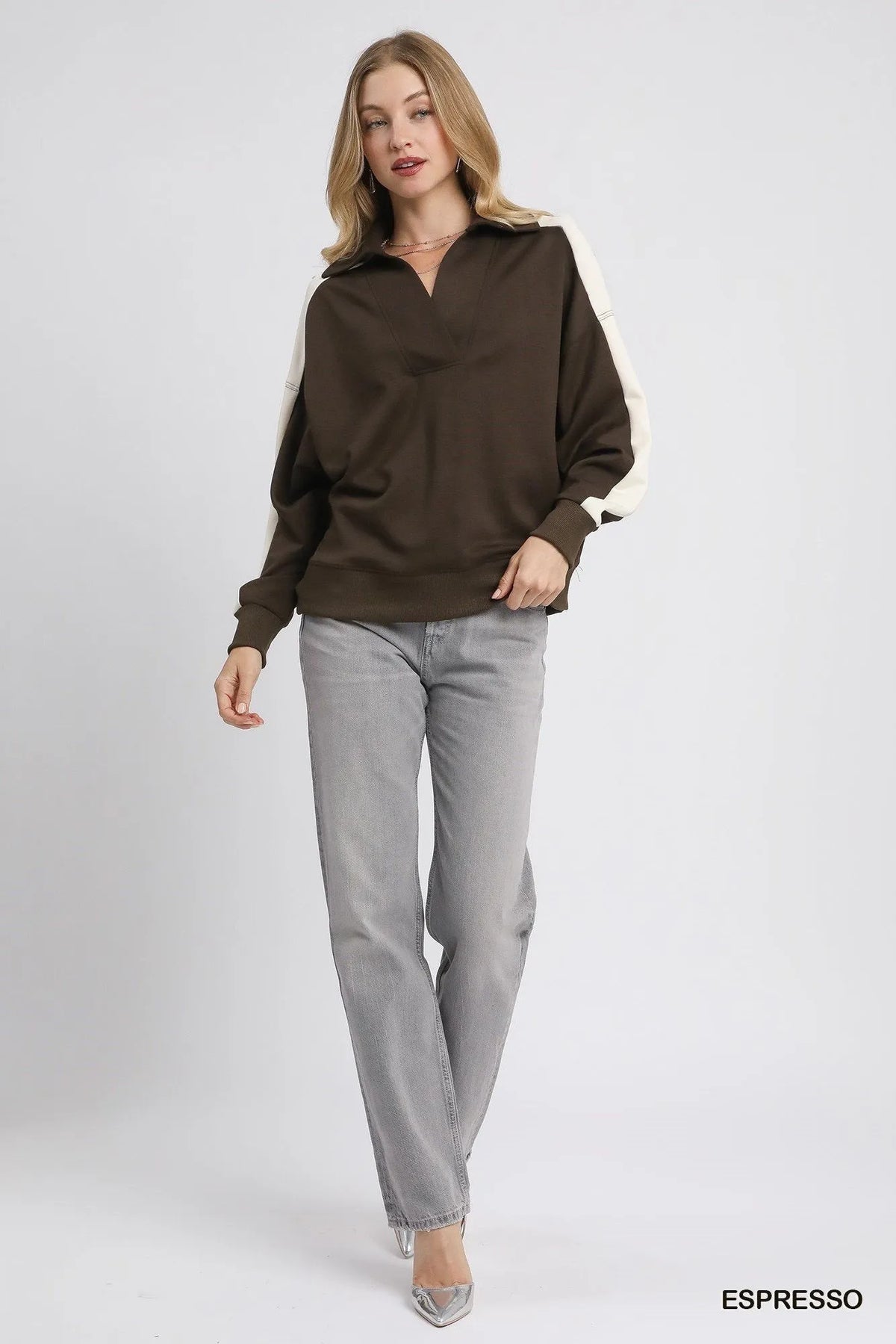 Dark brown polo sweatshirt with cream sleeve panels and relaxed fit
