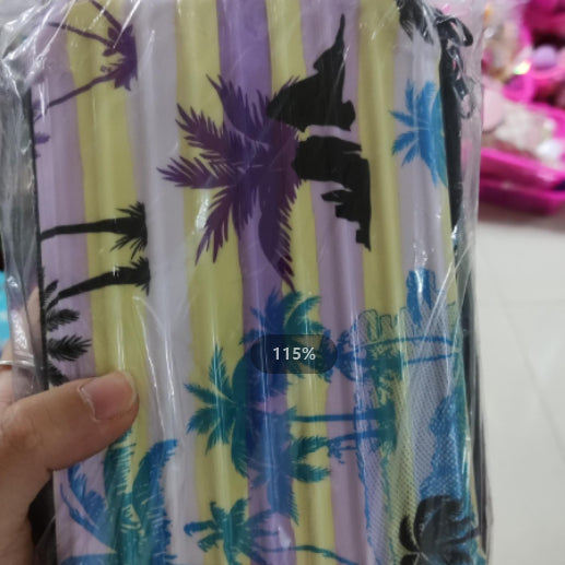 Cosmetic bag in cream with blue and purple tropical palm print.