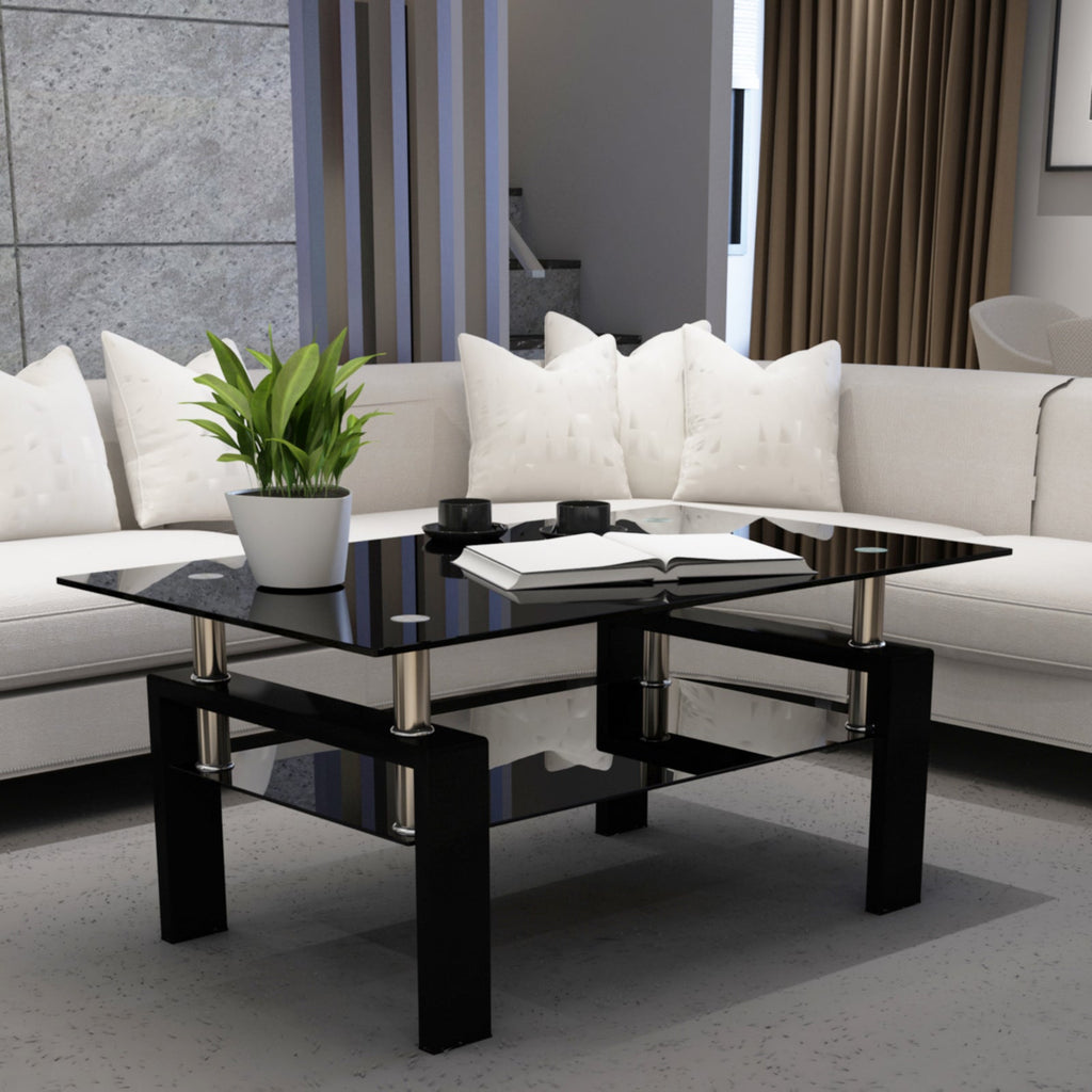 Modern black glass coffee table with clear top and chrome-accented legs