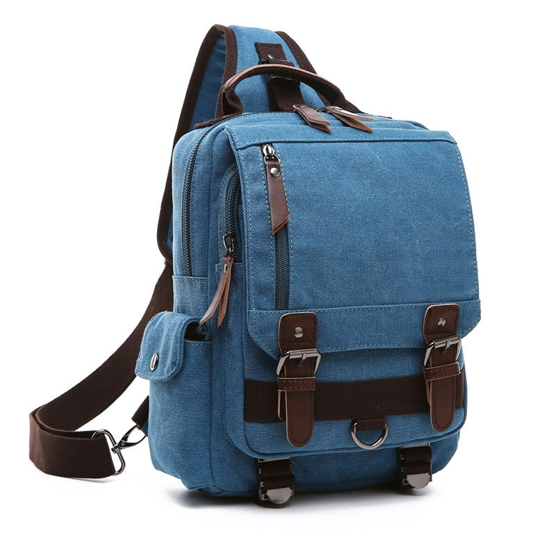 Light blue canvas backpack with front buckled straps, side zipper pocket, and shoulder strap
