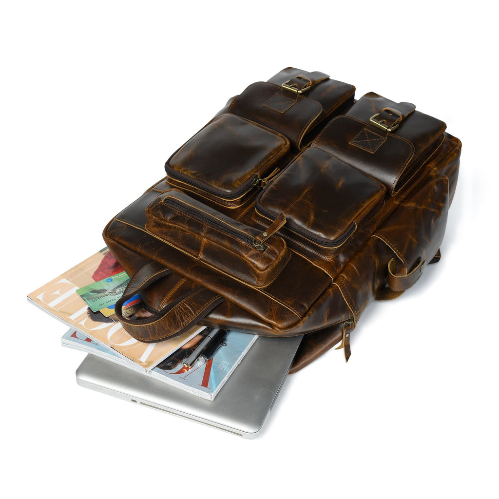 Brown leather backpack showing front pockets and buckled straps over documents