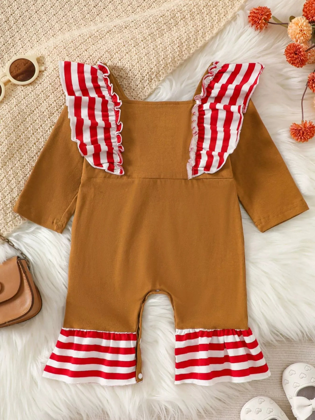 Caramel toddler jumpsuit with striped ruffle sleeves and snap-button legs