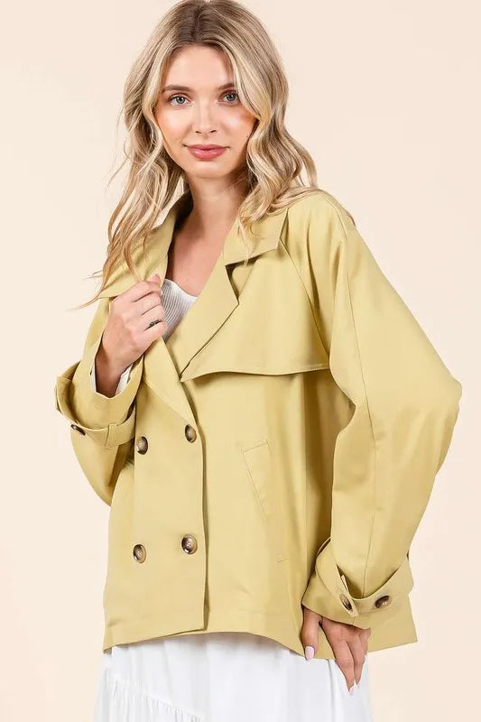 Yellow double-breasted trench coat jacket with pointed collar and button front