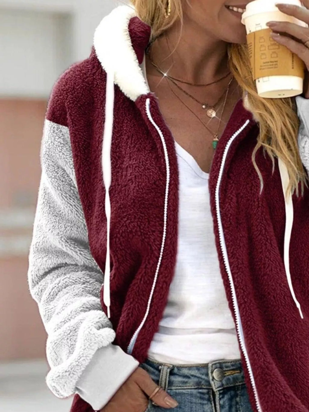 Burgundy fleece zip-up hoodie with hood, contrasting light gray sleeves and white trim