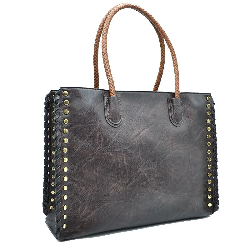 Dark gray faux leather tote bag with studded whipstitch trim and two top handles.