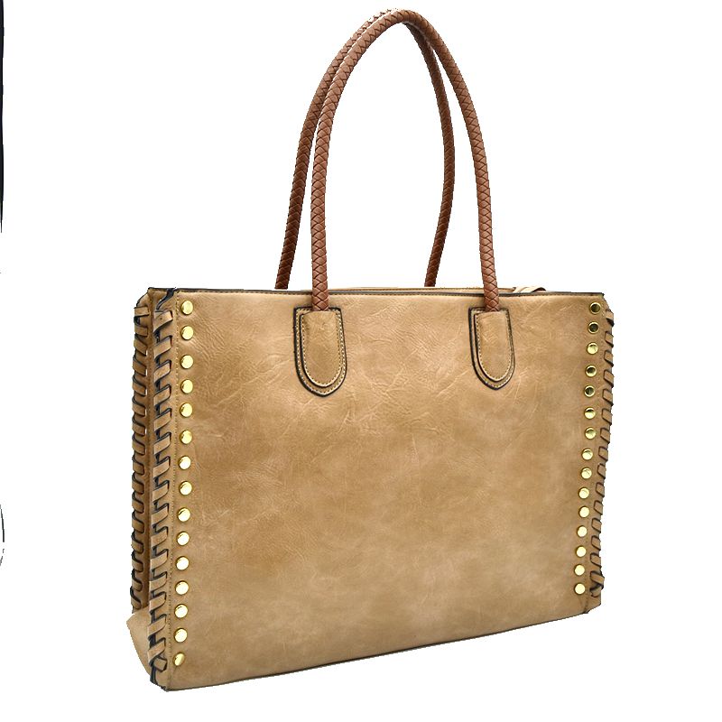 Studded faux leather tote bag with whipstitch trim, top handles, light tan color