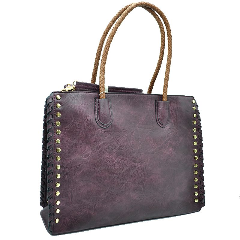 Faux leather tote bag in dark purple with studded edges, whipstitch trim, and rope handles