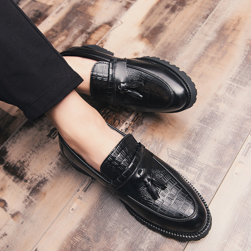 Men's leather loafers with tassel detail, black with embossed pattern strap
