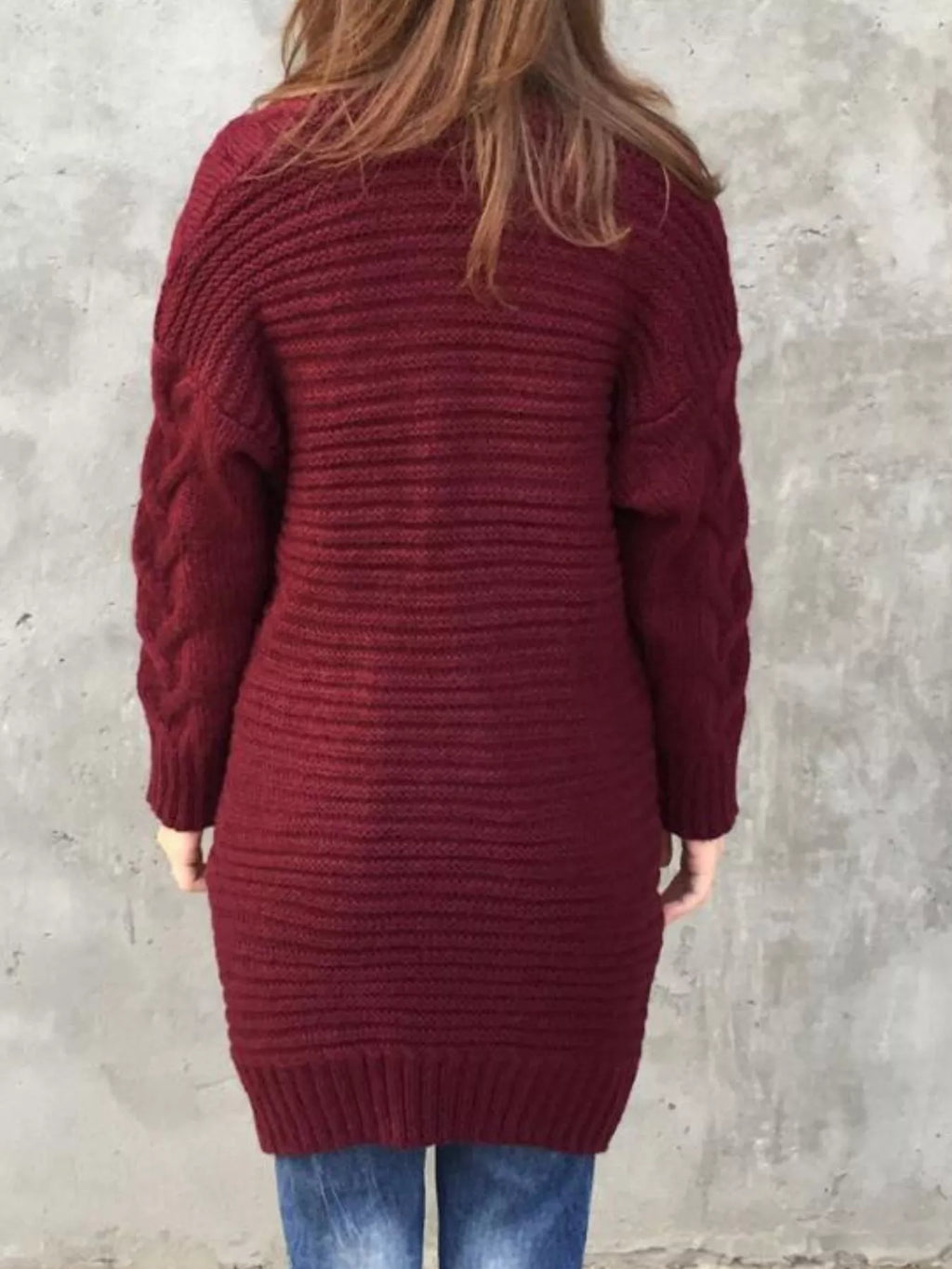 Burgundy chunky knit cardigan back view with ribbed hem and cable texture