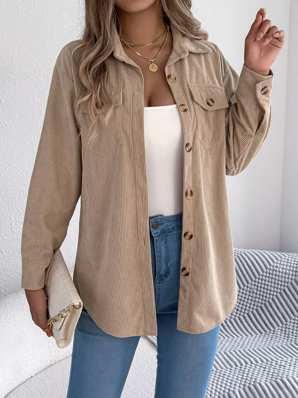 Khaki corduroy long button-up shacket with point collar and flap chest pockets.