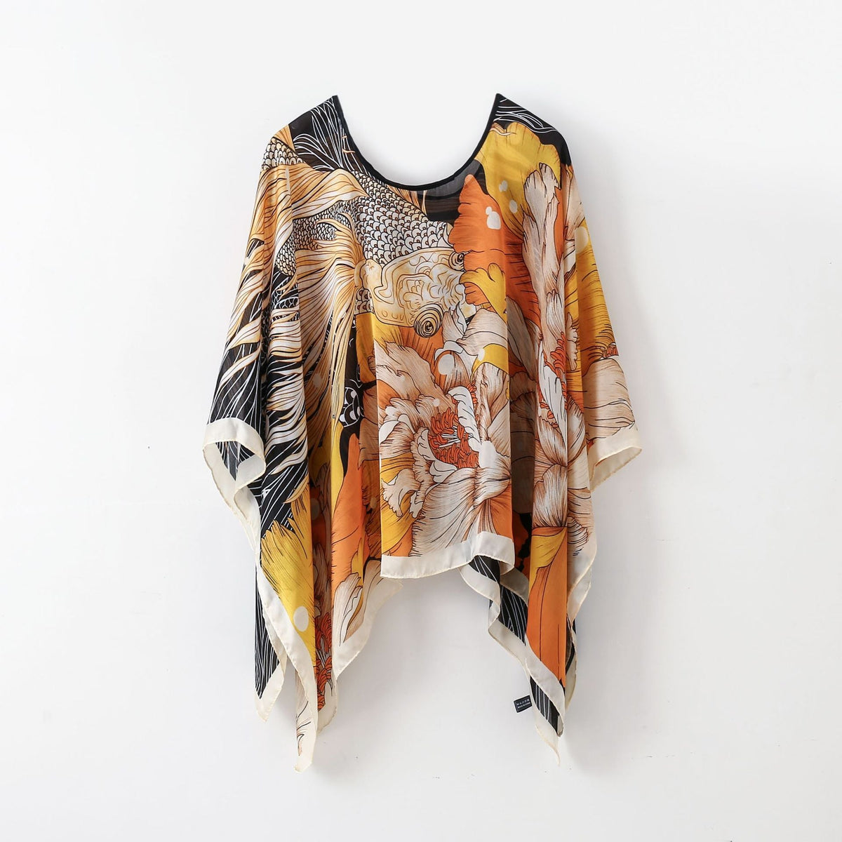 Orange, yellow, and tan animal wrap poncho shawl with fringe hem and round neck