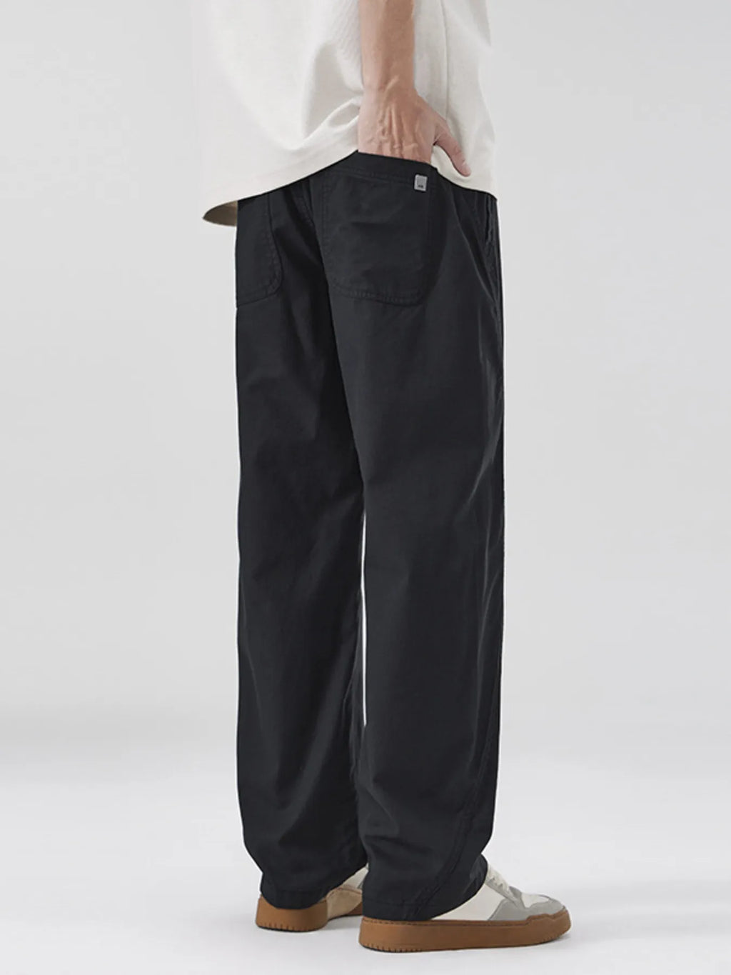 Black loose-fit casual pants with roomy fit and back patch pocket