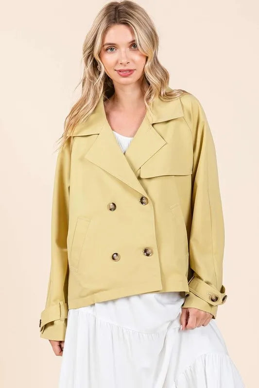 Yellow double-breasted trench coat jacket with notched lapels and long sleeves
