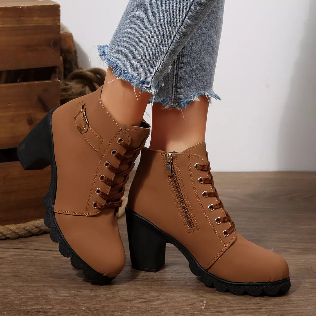 Tan lace-up ankle boots with chunky heel and side zipper, buckle strap and thick tread sole