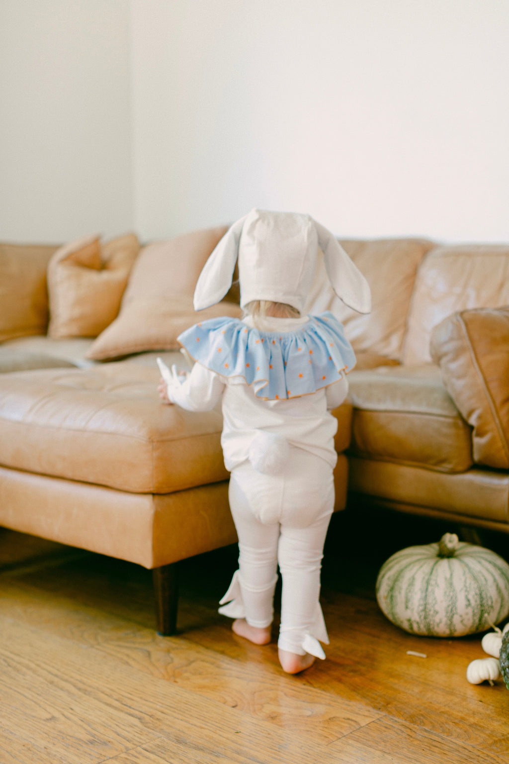 Baby bunny costume in white with long-eared hood and light blue star ruffle