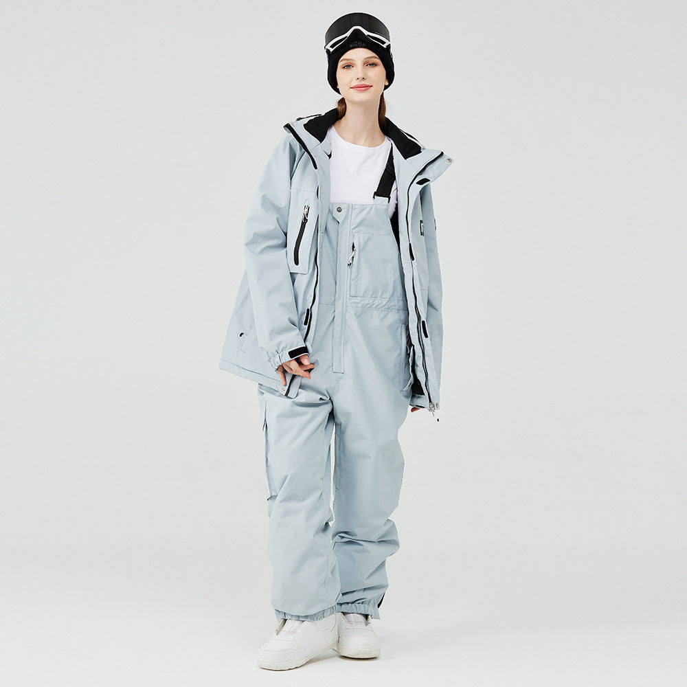 Light blue winter ski suit with hooded jacket and snow pants, black accents and straps