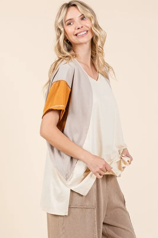 Color-block V-neck short-sleeve t-shirt, cream body with orange sleeve panel