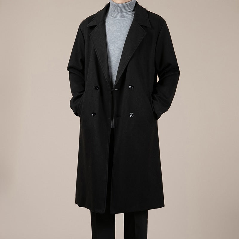 Black mid-length wool coat with notched lapels, double-breasted buttons, and front belt tie