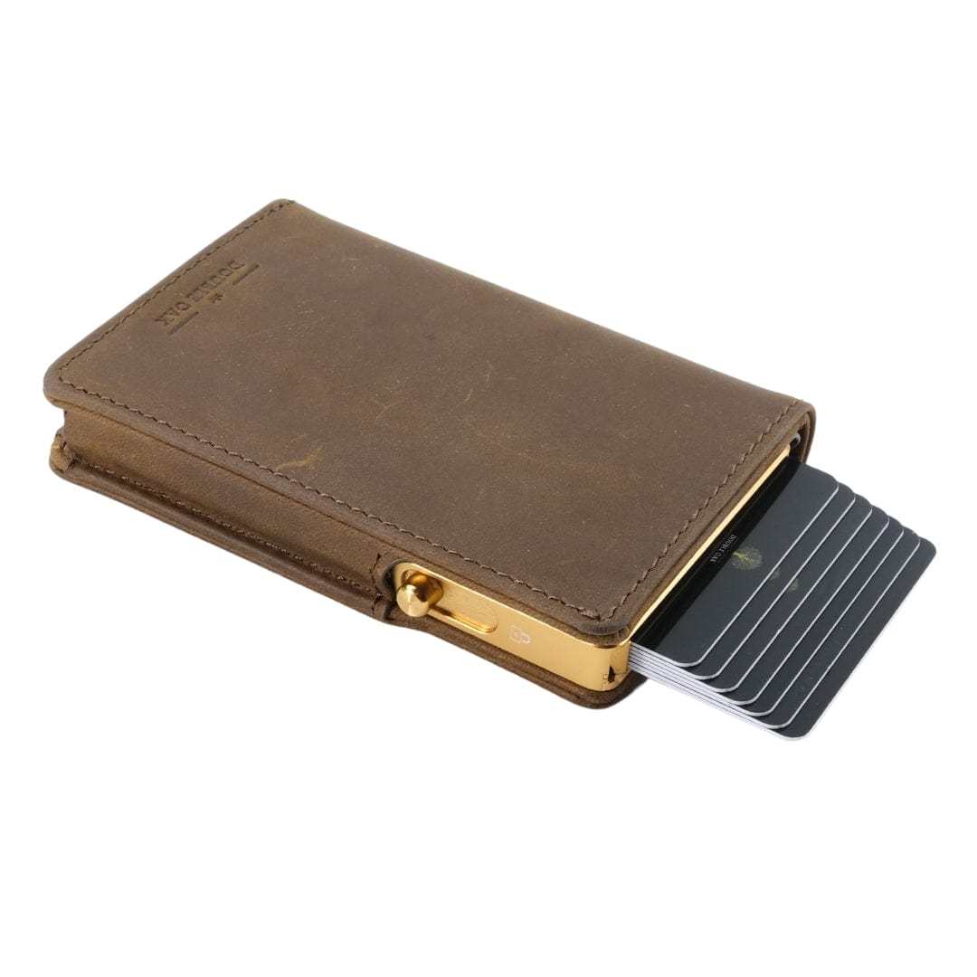 Brown leather bifold wallet with gold clasp and card slots, front view.