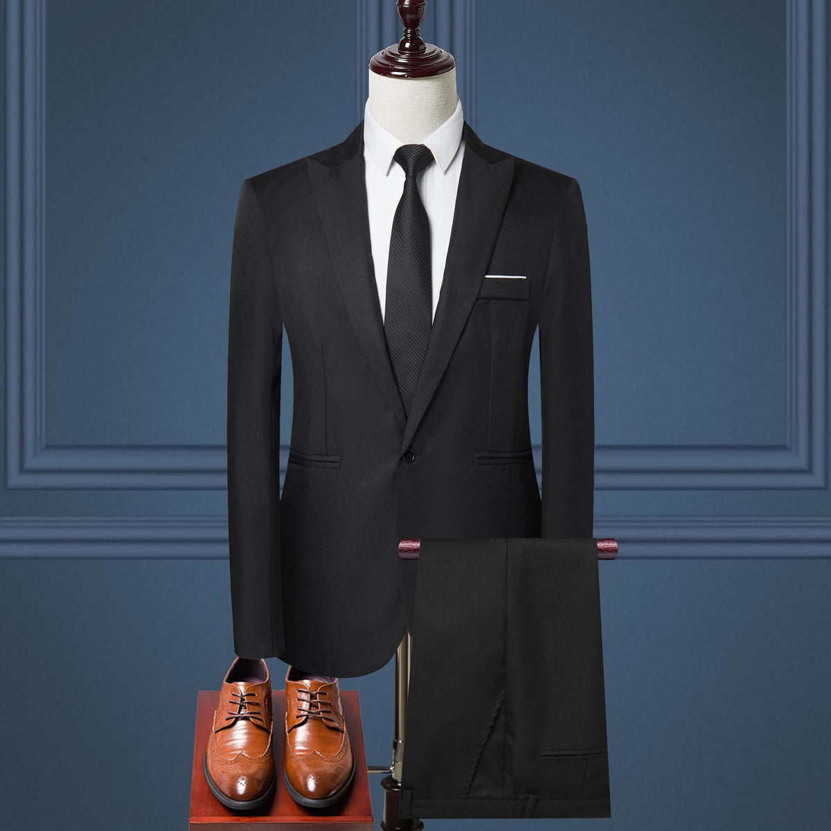 Men's black two-piece suit set with matching blazer and shorts