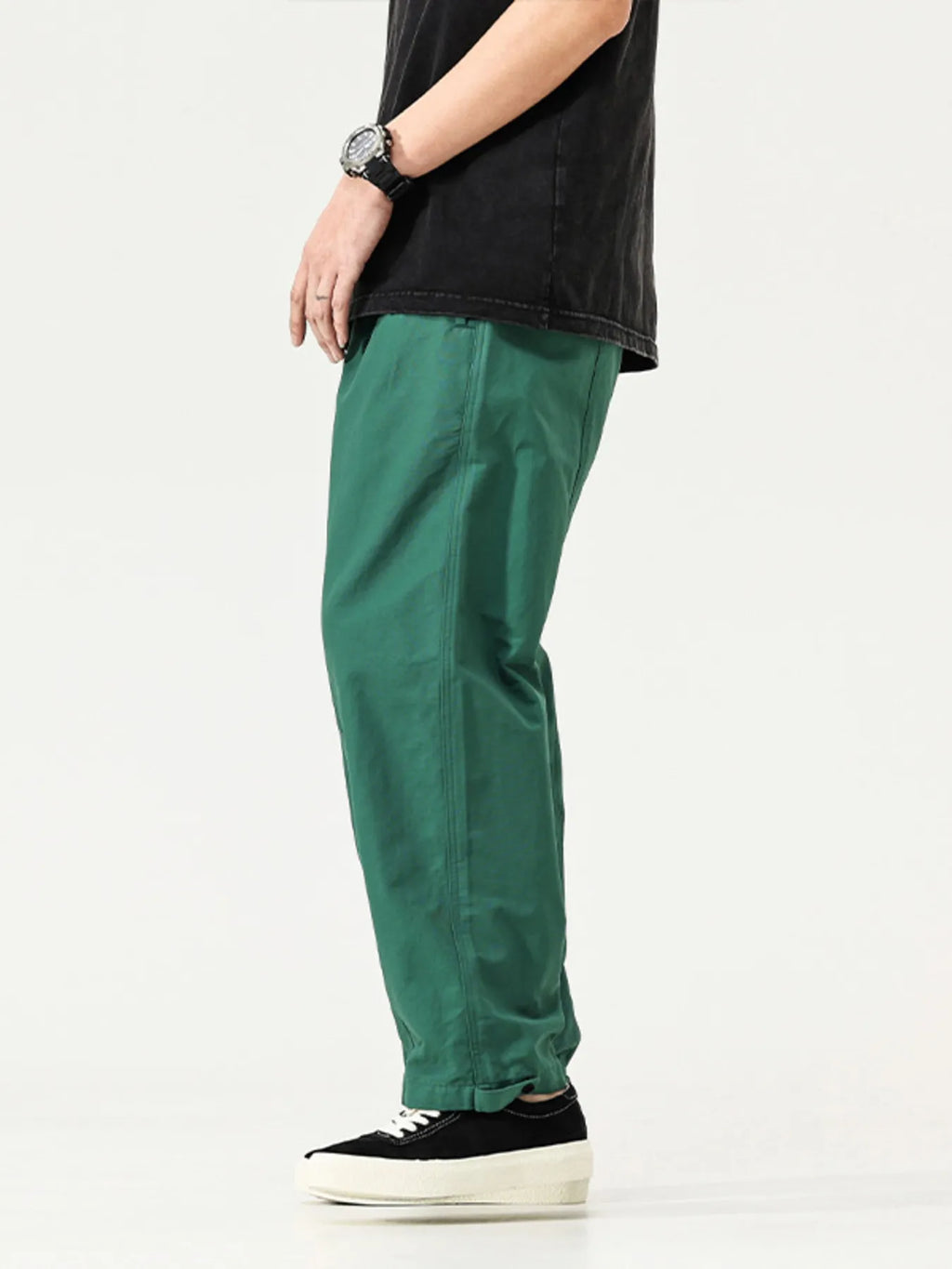 Men's emerald green cargo pants, side pocket detail and tapered ankle cuffs
