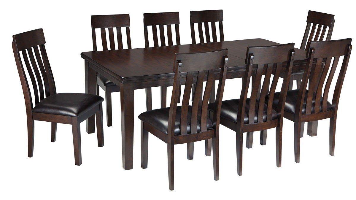 Dark brown dining table with eight side chairs featuring vertical slat backs