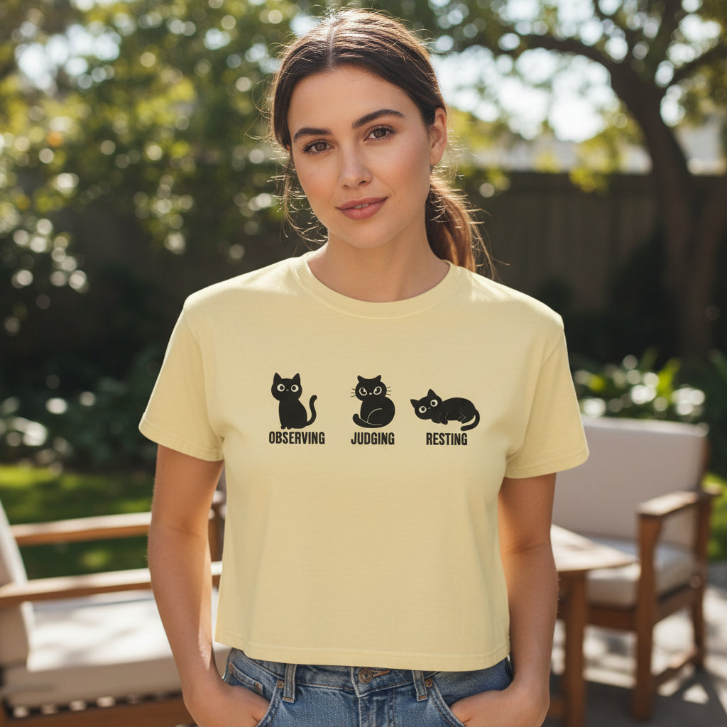 Boxy cropped cat tee in butter yellow with black cat trio graphic and text