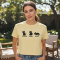 Boxy cropped cat tee in butter yellow with black cat trio graphic and text